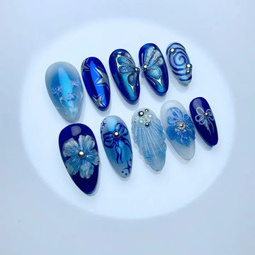 24Pcs Mid-length Blue Almond False Nails with 3D Shell Design Press on Nails Tips Butterfly Flower Pattern Datachable Fake Nail